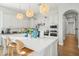 Bright kitchen featuring white cabinetry, a center island, and stylish pendant lighting at 3917 E Patrick Ln, Phoenix, AZ 85050