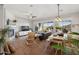Spacious living room with wood floors, fireplace, and large windows overlooking backyard at 3917 E Patrick Ln, Phoenix, AZ 85050