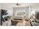 Bright bedroom with light-colored walls, ceiling fan, and a plush bed at 3917 E Patrick Ln, Phoenix, AZ 85050