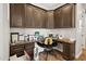 Home office area with custom cabinets and desk, offering a functional and stylish workspace for remote work at 3917 E Patrick Ln, Phoenix, AZ 85050