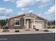 Charming single-story home featuring a two-car garage and a covered front porch, perfect for a cozy, inviting entry at 4525 S 95Th Dr, Tolleson, AZ 85353