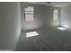 A bedroom with 2 windows is shown at 46868 W Old Timer Rd, Maricopa, AZ 85139
