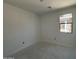 A bedroom with 1 window is shown at 46868 W Old Timer Rd, Maricopa, AZ 85139
