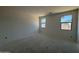 Bright bedroom with natural light pouring in through dual windows at 46868 W Old Timer Rd, Maricopa, AZ 85139
