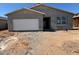 A single story home with a two car garage is shown at 46868 W Old Timer Rd, Maricopa, AZ 85139