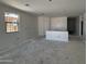 An unfinished living room with 1 window is shown at 46868 W Old Timer Rd, Maricopa, AZ 85139