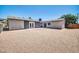 The spacious backyard features neutral paint, a gravel yard, and sliding glass doors at 5236 S 19Th Ave, Phoenix, AZ 85041