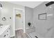 Luxurious bathroom featuring a stylish vanity, a modern walk-in shower, and contemporary design at 5236 S 19Th Ave, Phoenix, AZ 85041