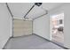 Attached garage with sealed floor and access to kitchen through interior door at 5236 S 19Th Ave, Phoenix, AZ 85041
