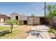 Exterior of backyard shed with siding and block construction set in a grassy yard at 5637 N 63Rd Dr, Glendale, AZ 85301