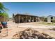 Expansive backyard with covered patio, shed, and fenced area, perfect for outdoor activities and entertaining at 5637 N 63Rd Dr, Glendale, AZ 85301