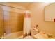 Bathroom with a shower and bathtub combo, a sink, and a mirror at 5637 N 63Rd Dr, Glendale, AZ 85301