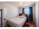 Bedroom featuring tile floors, and a window with curtains at 5637 N 63Rd Dr, Glendale, AZ 85301