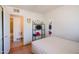 Bright bedroom featuring tile floors, open closet, and a doorway to the bathroom at 5637 N 63Rd Dr, Glendale, AZ 85301