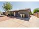 Home with gravel front yard and extra-long concrete driveway at 5637 N 63Rd Dr, Glendale, AZ 85301