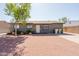 Charming single-story home with gravel front yard and mature landscaping at 5637 N 63Rd Dr, Glendale, AZ 85301