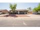 Inviting front yard with stone accents and extra long driveway for additional parking at 5637 N 63Rd Dr, Glendale, AZ 85301
