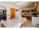 Eat in kitchen with classic cabinets and tile floors at 5637 N 63Rd Dr, Glendale, AZ 85301