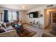 Spacious living room with tile floors, large window, and neutral colors at 5637 N 63Rd Dr, Glendale, AZ 85301
