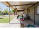 Covered patio with outdoor storage, a laundry area, and a view of the backyard at 5637 N 63Rd Dr, Glendale, AZ 85301