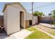 Backyard shed with an open door and a grassy exterior at 5637 N 63Rd Dr, Glendale, AZ 85301