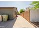 Spacious side yard with concrete driveway and security gate to backyard at 5637 N 63Rd Dr, Glendale, AZ 85301