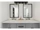 Modern bathroom featuring double sinks, stylish fixtures, and ample counter space at 5912 E Wethersfield Rd, Scottsdale, AZ 85254