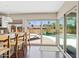 Kitchen seating area with open view to the backyard pool at 5912 E Wethersfield Rd, Scottsdale, AZ 85254