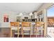 Kitchen island with seating and views to backyard at 5912 E Wethersfield Rd, Scottsdale, AZ 85254