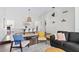 Well-lit living space with modern decor, seamlessly blending the dining and living areas at 5912 E Wethersfield Rd, Scottsdale, AZ 85254