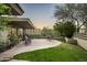 Beautifully landscaped backyard with a spacious patio and well-maintained lawn at 6306 N Camelback Manor Dr, Paradise Valley, AZ 85253