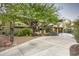 Stately home featuring mature trees, lush landscaping, and a circular driveway at 6306 N Camelback Manor Dr, Paradise Valley, AZ 85253