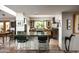 Open kitchen featuring stone floors, island with seating, natural light, and stainless steel appliances at 6306 N Camelback Manor Dr, Paradise Valley, AZ 85253