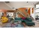 Open living area with a modern staircase, seating, and unique floor at 6306 N Camelback Manor Dr, Paradise Valley, AZ 85253