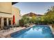 Inviting backyard pool area with mountain views, modern patio furniture, and lush desert landscaping at 6306 N Camelback Manor Dr, Paradise Valley, AZ 85253