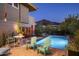 Inviting backyard pool area with comfortable seating, a vibrant mountain view and lush landscaping at 6306 N Camelback Manor Dr, Paradise Valley, AZ 85253