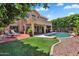 Beautiful backyard with a pool and landscaping, perfect for relaxation at 6376 W Louise Dr, Glendale, AZ 85310