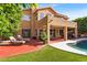Backyard retreat featuring a covered patio, lounge chairs, and a sparkling pool, perfect for outdoor enjoyment at 6376 W Louise Dr, Glendale, AZ 85310
