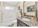 Bright bathroom featuring a sink with granite countertop and a shower at 6376 W Louise Dr, Glendale, AZ 85310