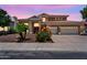 Stunning home with a three-car garage, desert landscaping, and a tile roof in a desirable neighborhood at 6376 W Louise Dr, Glendale, AZ 85310