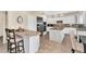 Bright kitchen features white cabinets, granite countertops, stainless steel appliances, and a functional center island at 6376 W Louise Dr, Glendale, AZ 85310