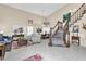 Elegant living room with high ceilings, large windows, and a striking staircase at 6376 W Louise Dr, Glendale, AZ 85310