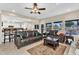 Open-concept living room featuring tile floors and seamless transition to the kitchen at 6376 W Louise Dr, Glendale, AZ 85310