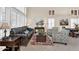 Comfortable living room with neutral paint, plantation shutters, and tile floors at 6376 W Louise Dr, Glendale, AZ 85310