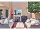 Inviting covered patio featuring cushioned seating, ideal for outdoor relaxation and entertaining with a beverage cooler at 6376 W Louise Dr, Glendale, AZ 85310