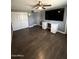 Spacious bedroom with wood-look floors, neutral paint, a ceiling fan, and a large closet at 6429 W Palm Ln, Phoenix, AZ 85035