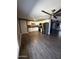 Modern kitchen with stainless steel appliances, white cabinets, and updated flooring at 6429 W Palm Ln, Phoenix, AZ 85035