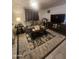 Cozy living room featuring comfortable seating, a decorative rug, and a modern entertainment center at 6733 W Sherri Jean Ln, Peoria, AZ 85382