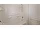 Clean white tiled bathroom with a shower and toilet in a well-lit space at 694 W Desert Seasons Dr, San Tan Valley, AZ 85143