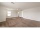 Expansive bedroom featuring soft carpet, neutral walls, and direct access to an ensuite bathroom at 694 W Desert Seasons Dr, San Tan Valley, AZ 85143